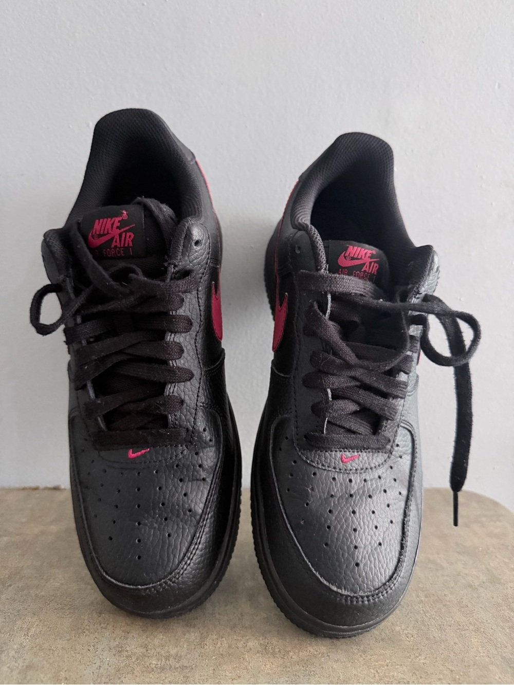 Nike Air Force 1 Low-Top Sneakers in Black with Pink Swoosh